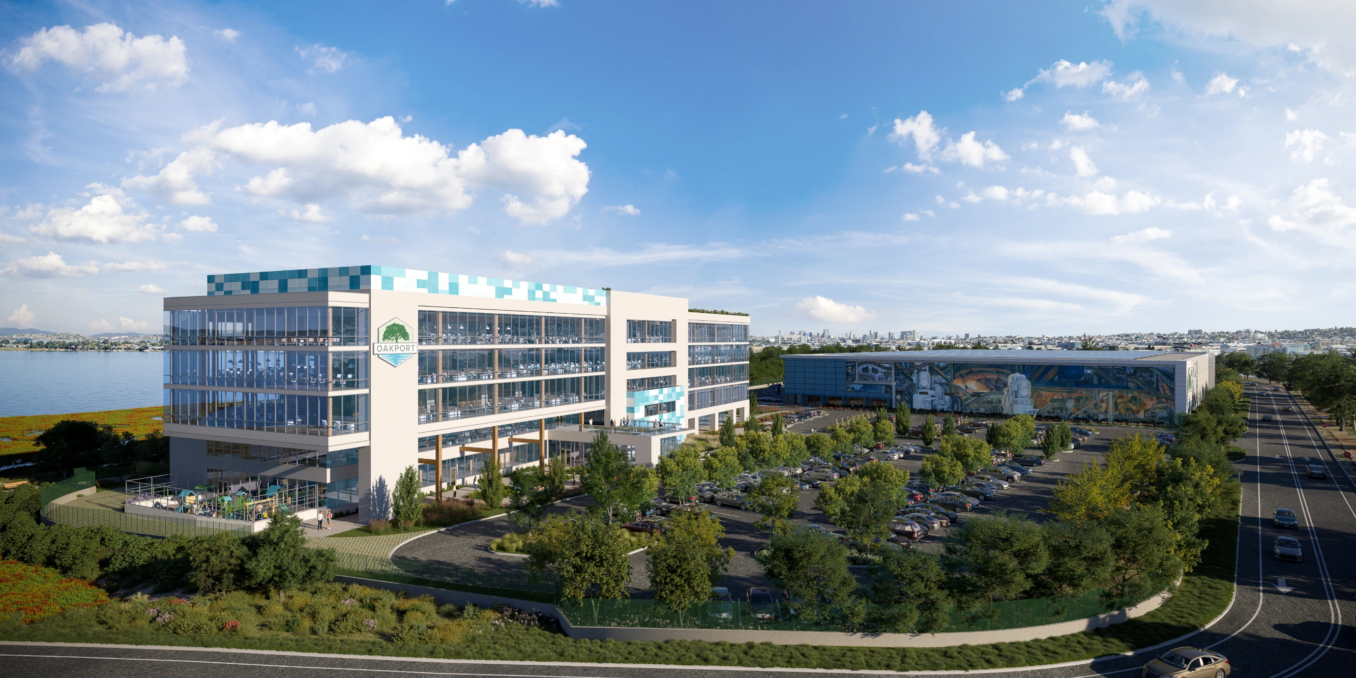 Contemporary glass corporate headquarters overlooking bay with city skyline backdrop