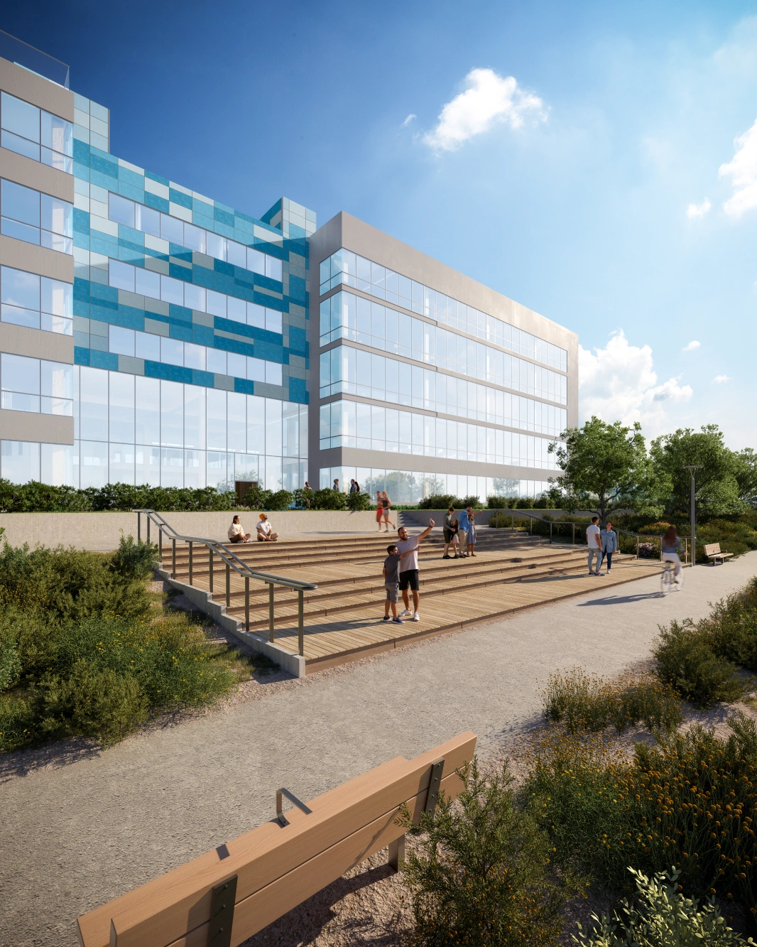 Four story commercial office complex with expansive windows and pedestrian plaza