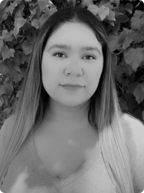 Professional black and white headshot of young woman with long straight hair
