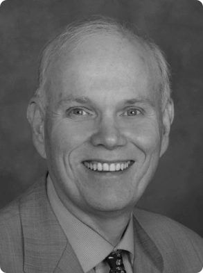 Corporate portrait featuring senior male executive in formal business attire