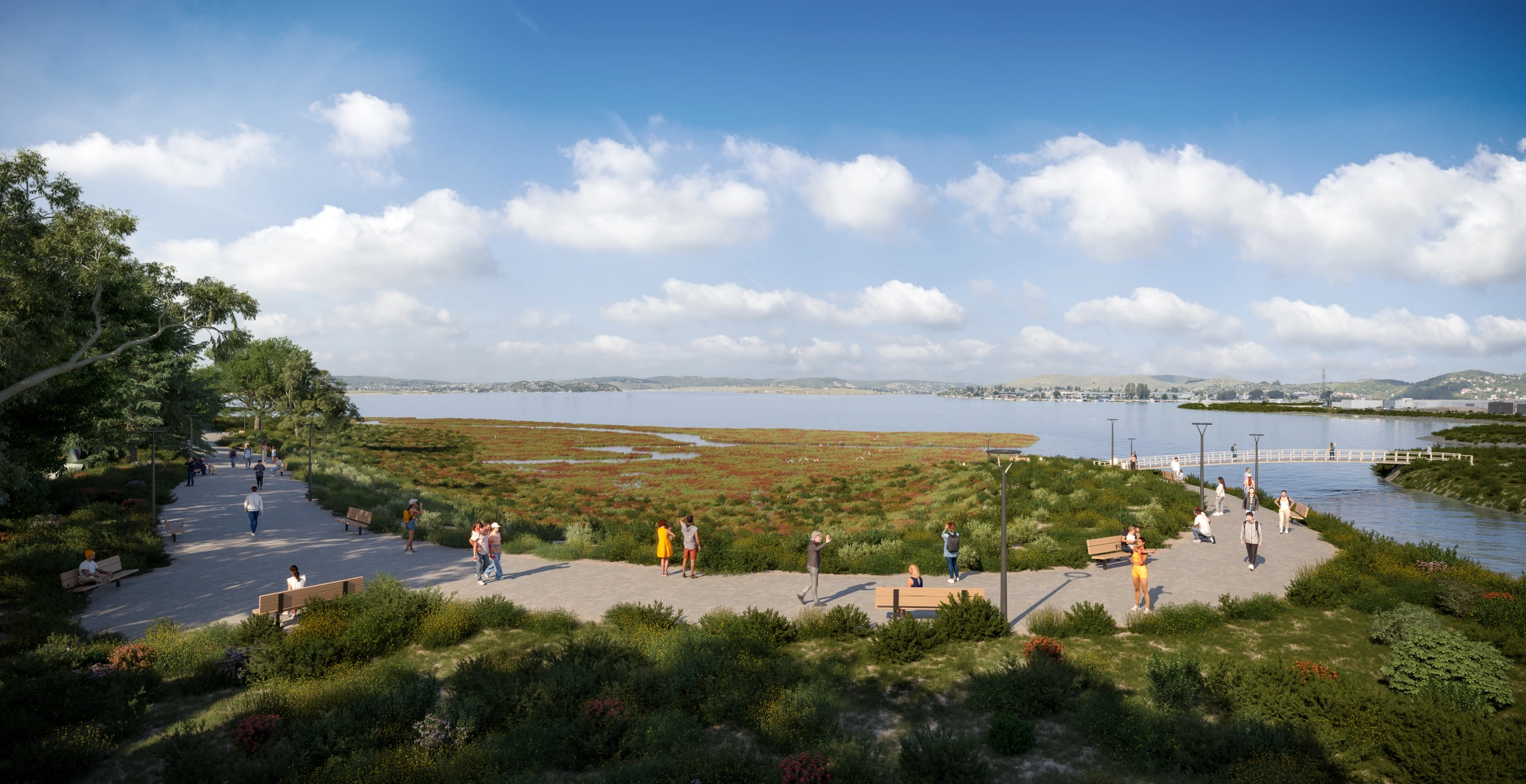 Bayfront walking trail featuring native landscaping benches and open water
