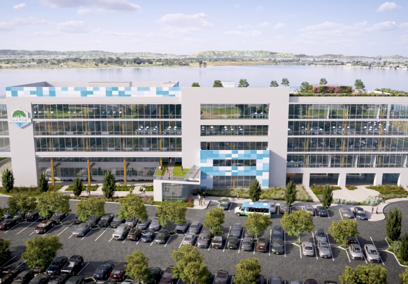 Contemporary glass corporate headquarters featuring blue panel accents and parking lot