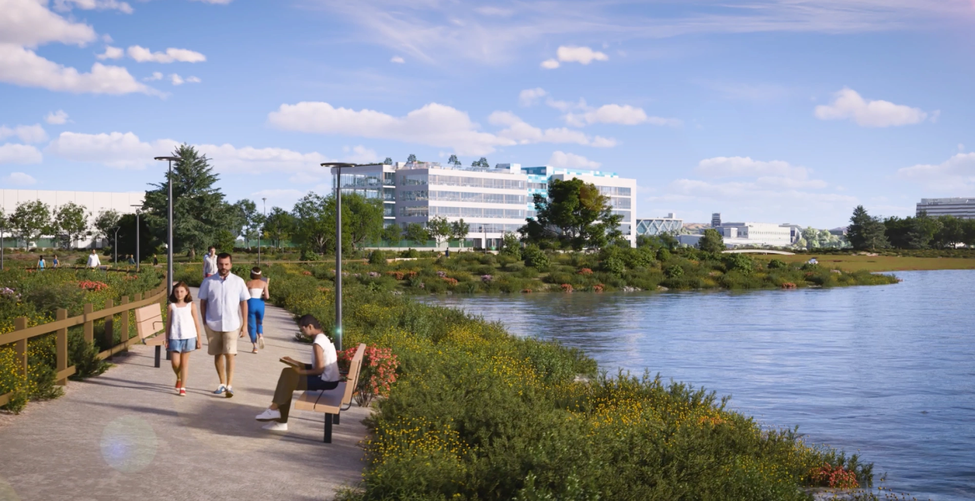 Riverside trail with benches wildflowers and corporate campus in background